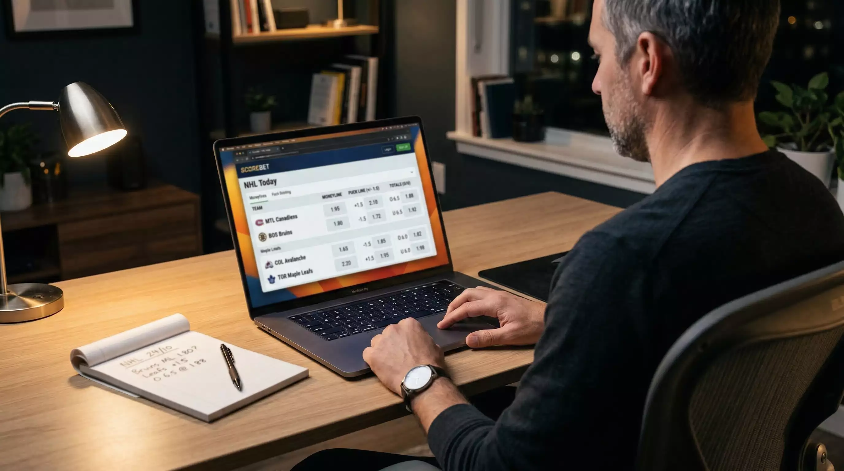 Mesa de análisis con pantalla mostrando mercados de apuestas de hockey sobre hielo NHL